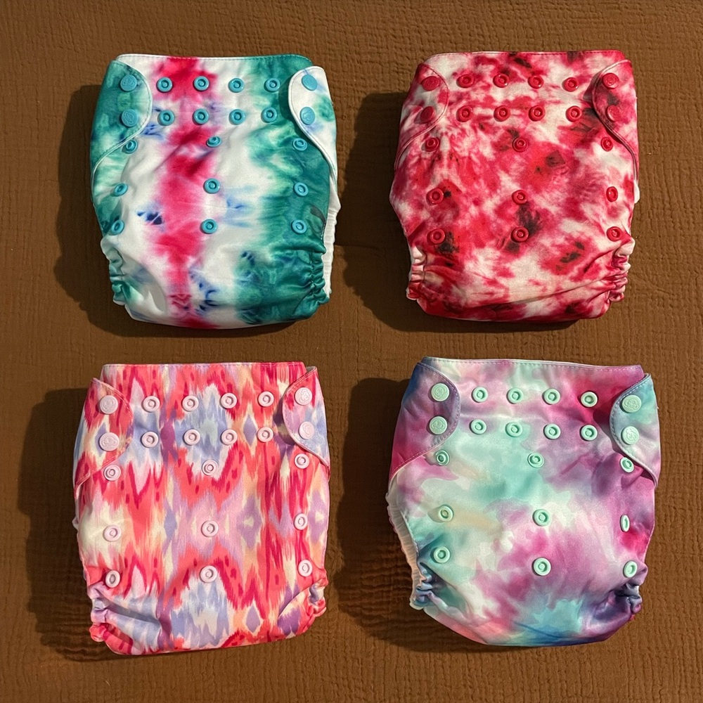 Four Mama Koala Diapers with four inserts. Never worn!